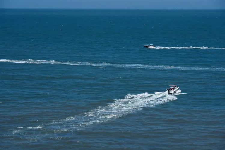 Speedboat cutting through ocean waves